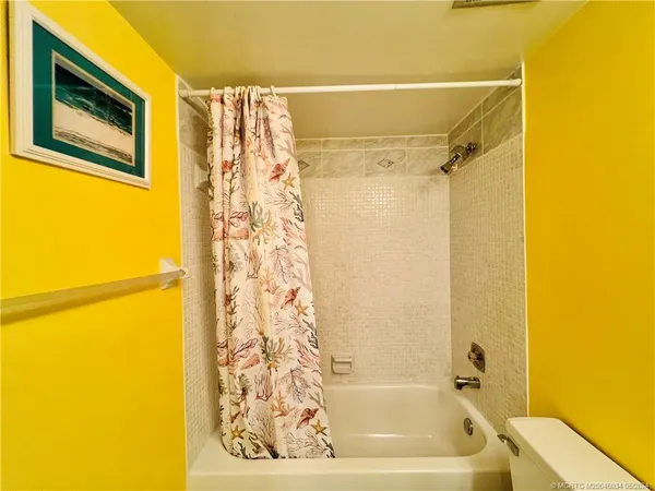 a swimming pool with outdoor seating and yard