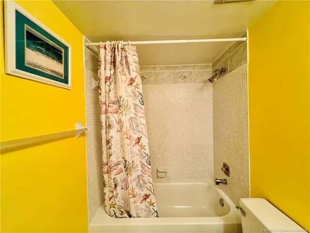 a swimming pool with outdoor seating and yard