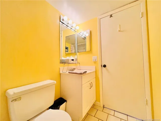 a view of a swimming pool with a patio and a yard