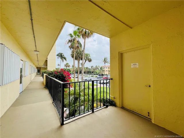 a view of balcony with furniture