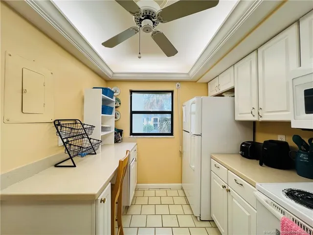 a kitchen with a refrigerator a stove top oven a sink and dishwasher