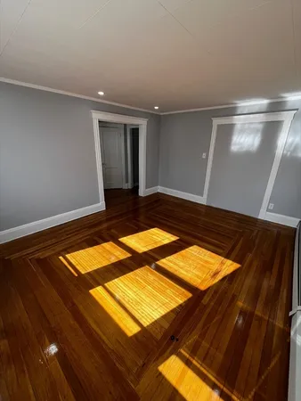 a view of room with wooden floor