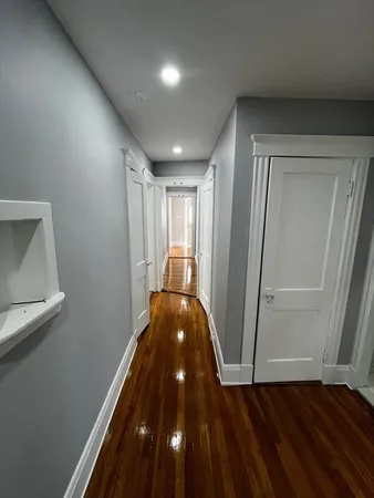 a view of entryway with wooden floor