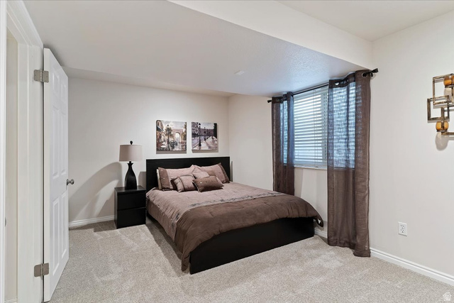 1924 North 2000th Street East Layton, UT 84040 - Photo 32 of 41 Bedroom featuring light colored carpet