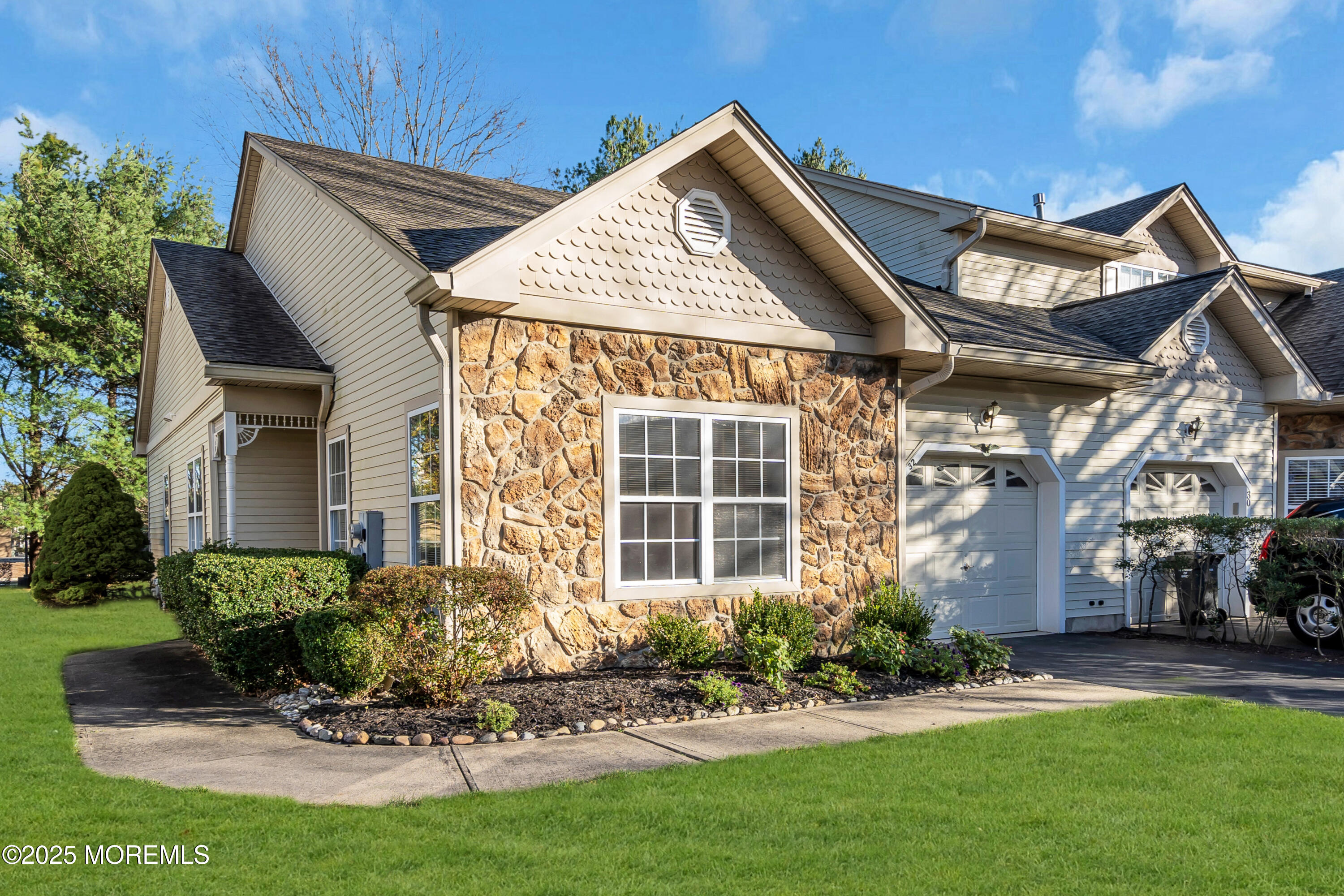 a view of a house with sitting area and garden