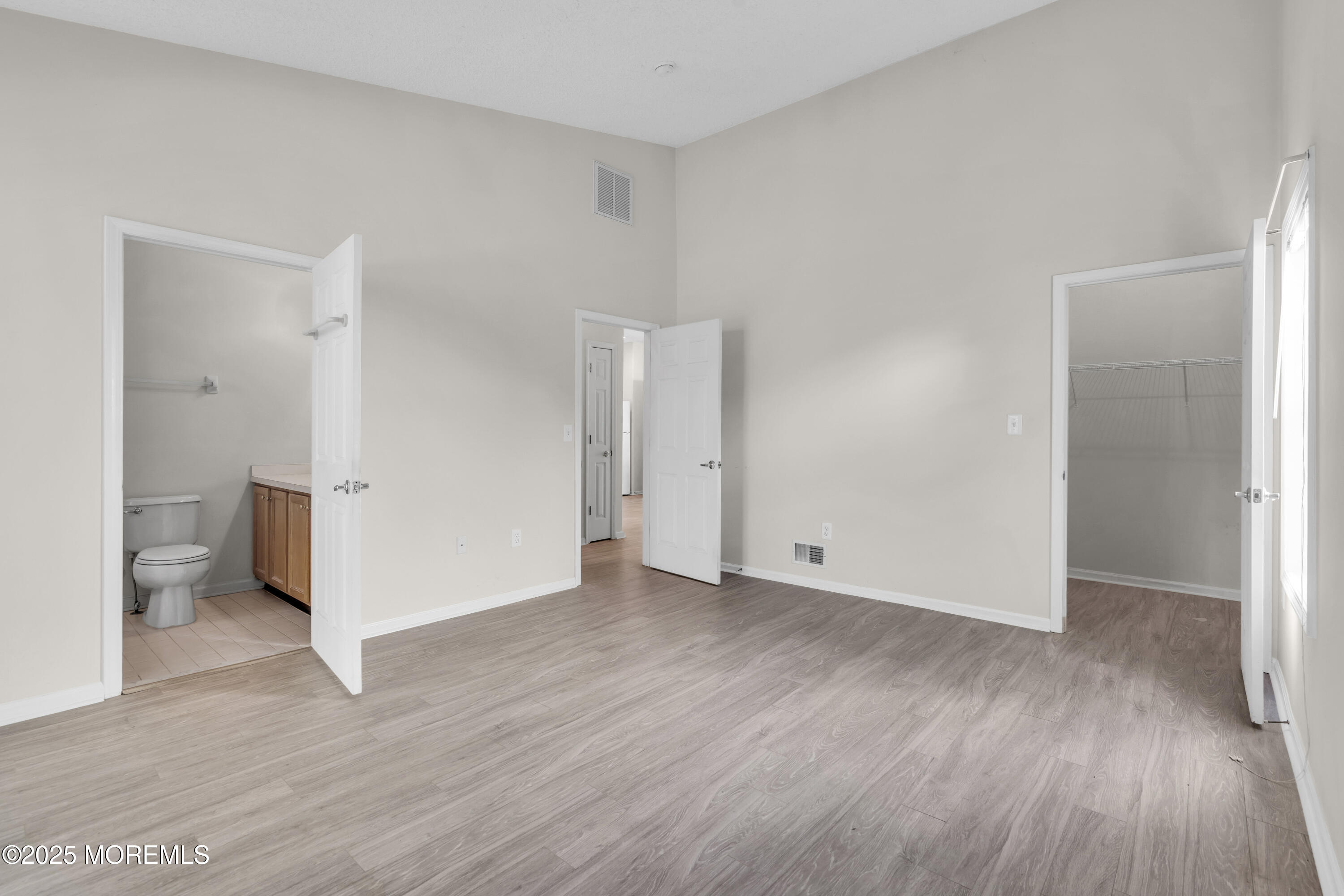 32 Riva Boulevard, Unit 2277 Brick, NJ 08723 - Photo 13 of 23 a view of a room with wooden floor and a toilet