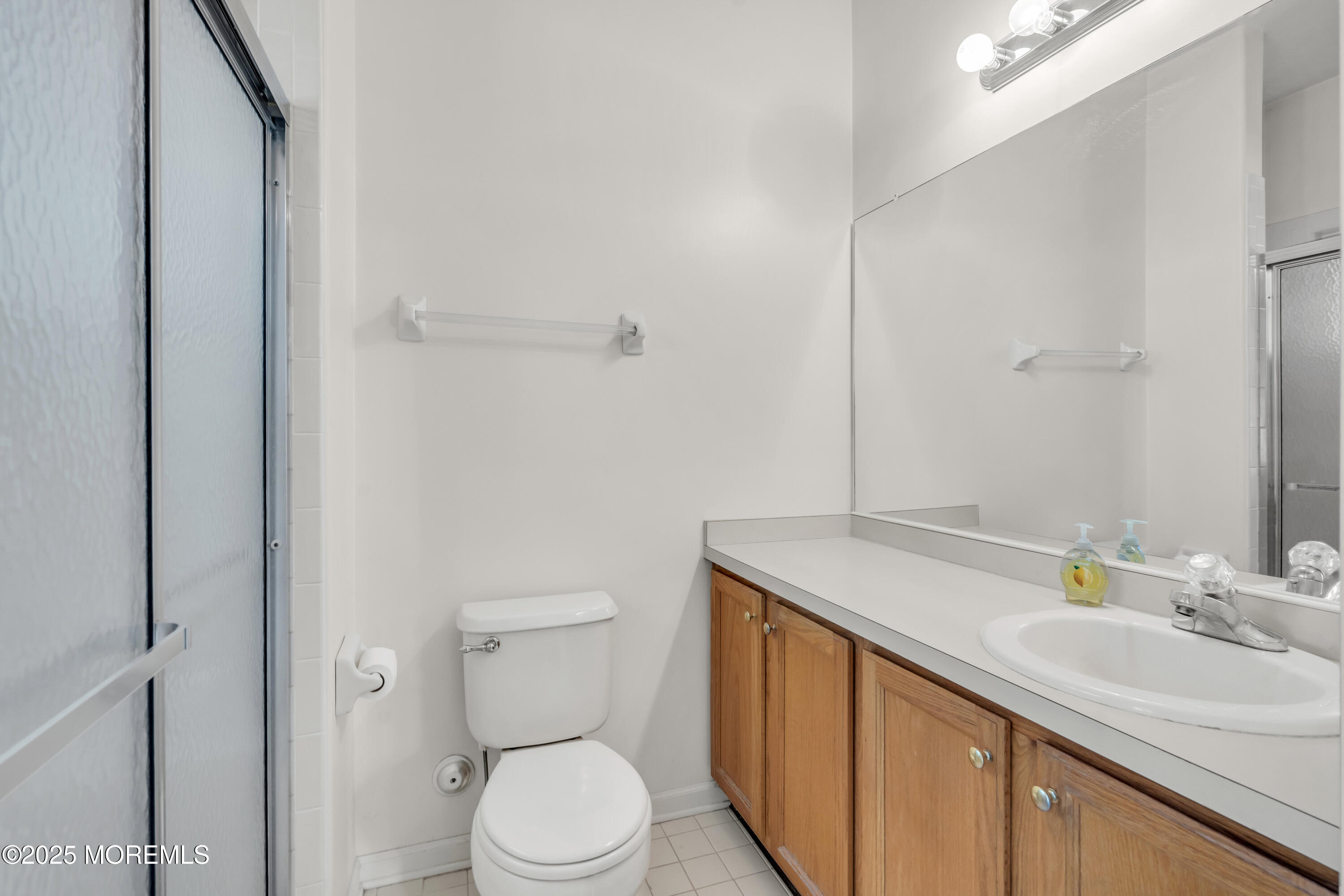 32 Riva Boulevard, Unit 2277 Brick, NJ 08723 - Photo 15 of 23 a bathroom with a sink toilet and vanity