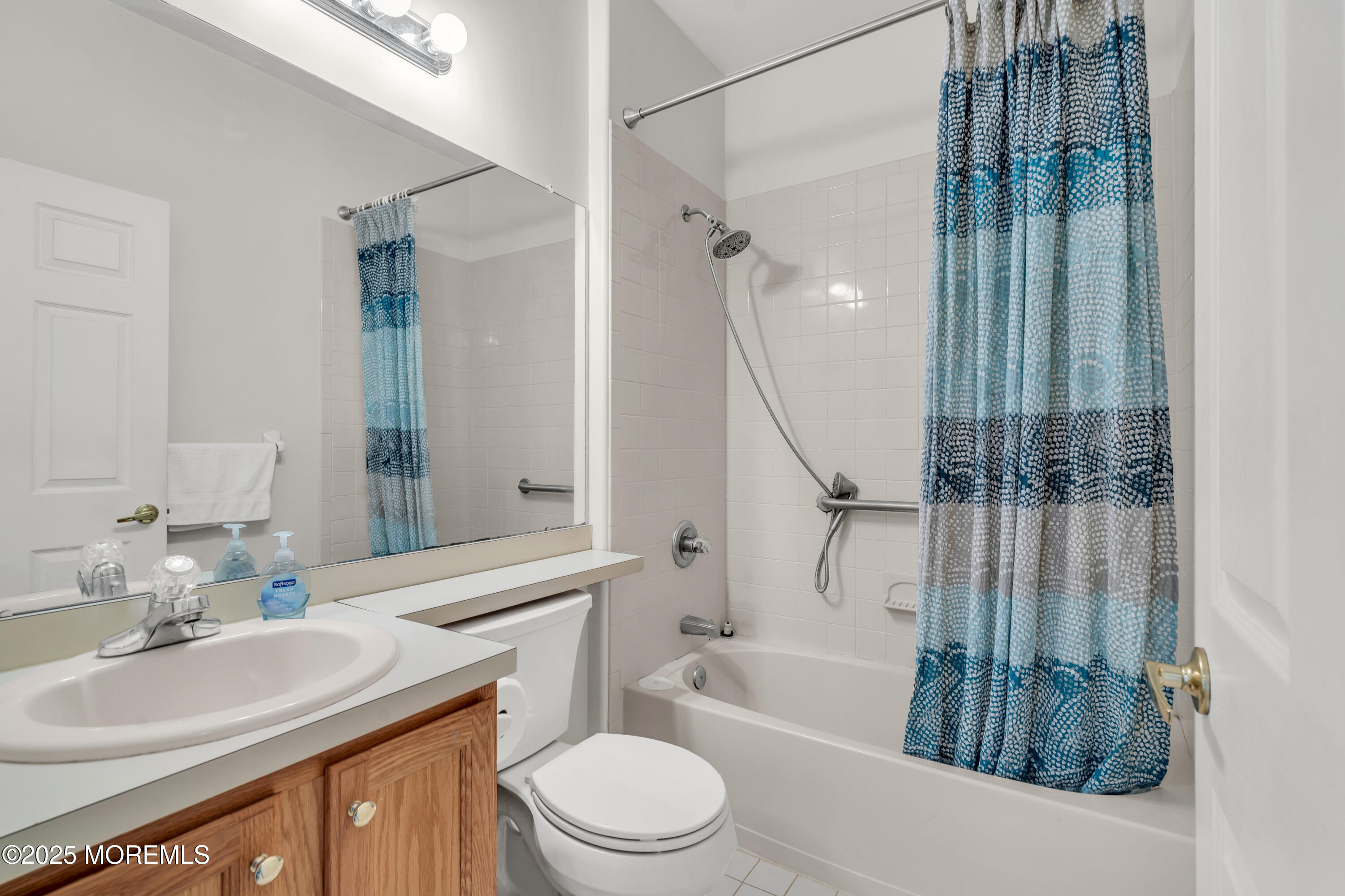 32 Riva Boulevard, Unit 2277 Brick, NJ 08723 - Photo 20 of 23 a bathroom with a sink a toilet and a bathtub