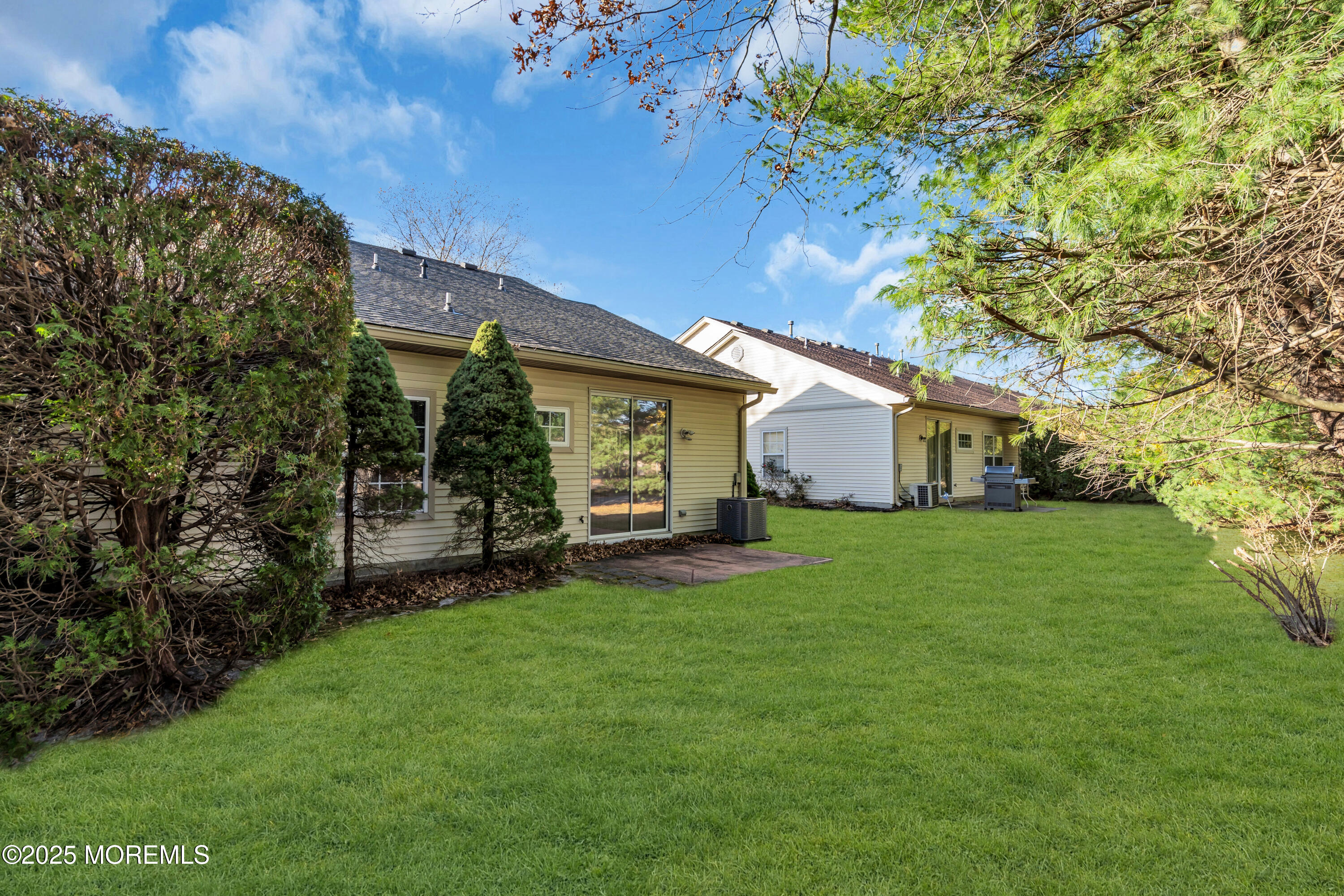 32 Riva Boulevard, Unit 2277 Brick, NJ 08723 - Photo 23 of 23 a view of a house with a back yard