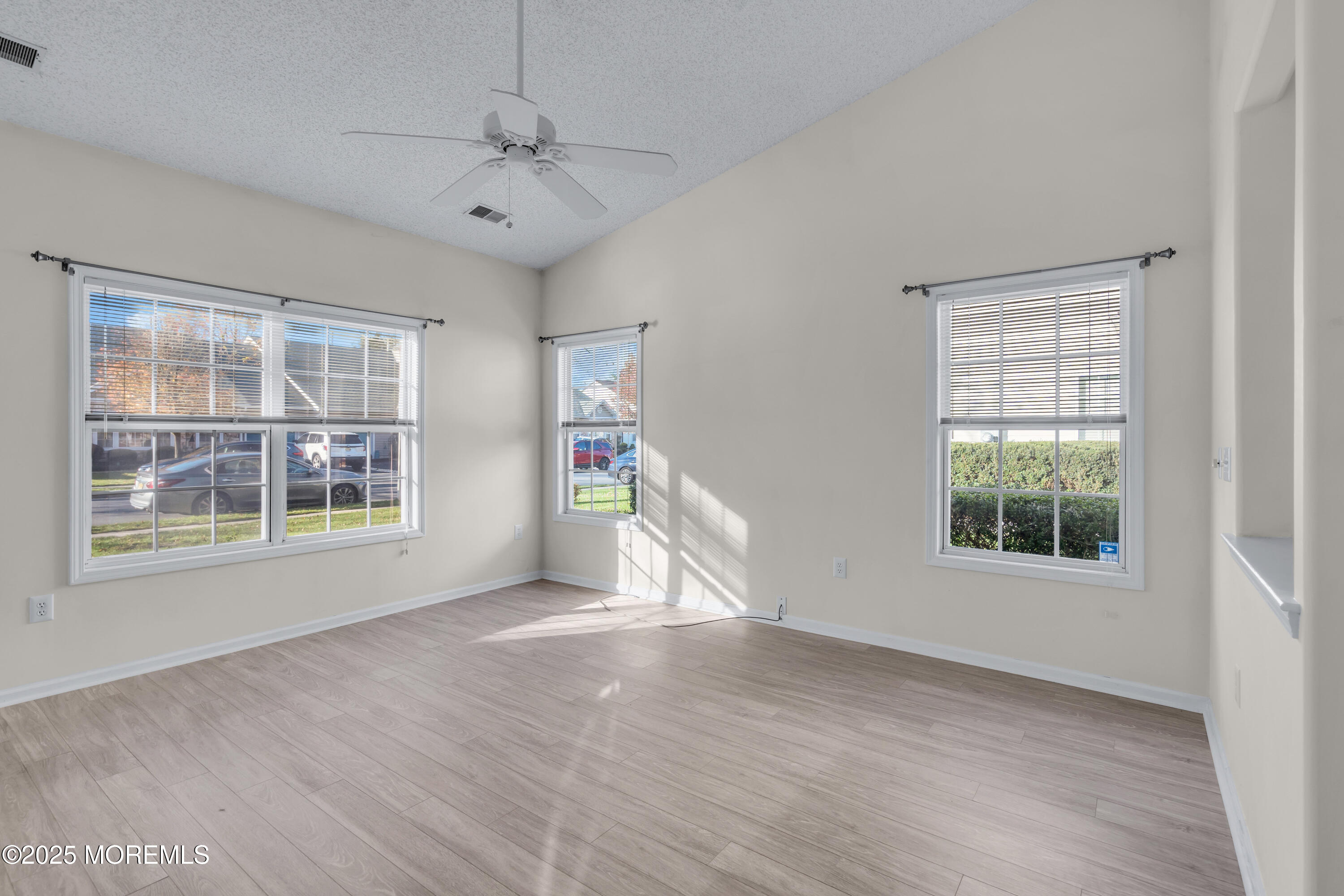 32 Riva Boulevard, Unit 2277 Brick, NJ 08723 - Photo 4 of 23 a view of an empty room with a window and wooden floor