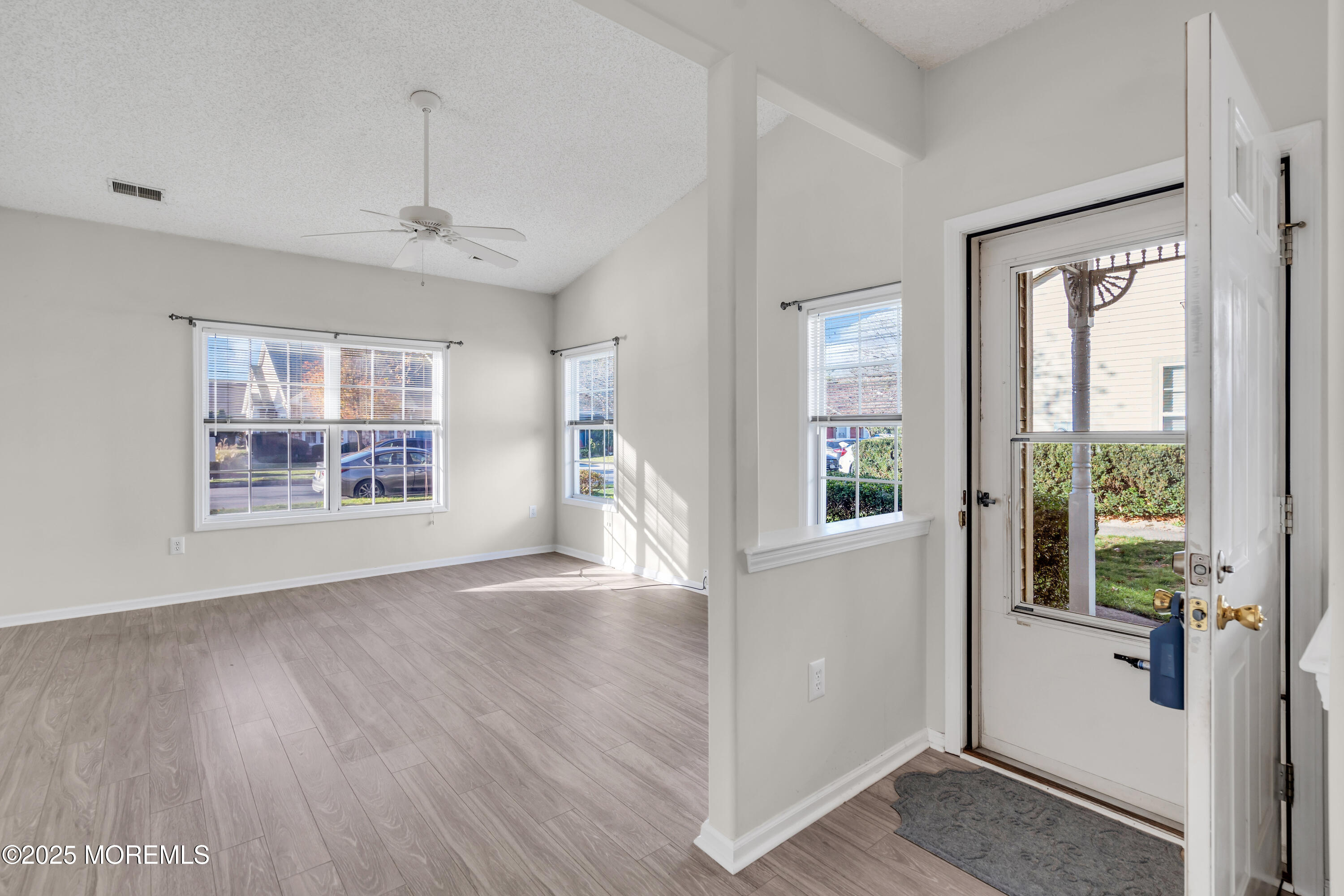 32 Riva Boulevard, Unit 2277 Brick, NJ 08723 - Photo 6 of 23 a view of an empty room with wooden floor and a window