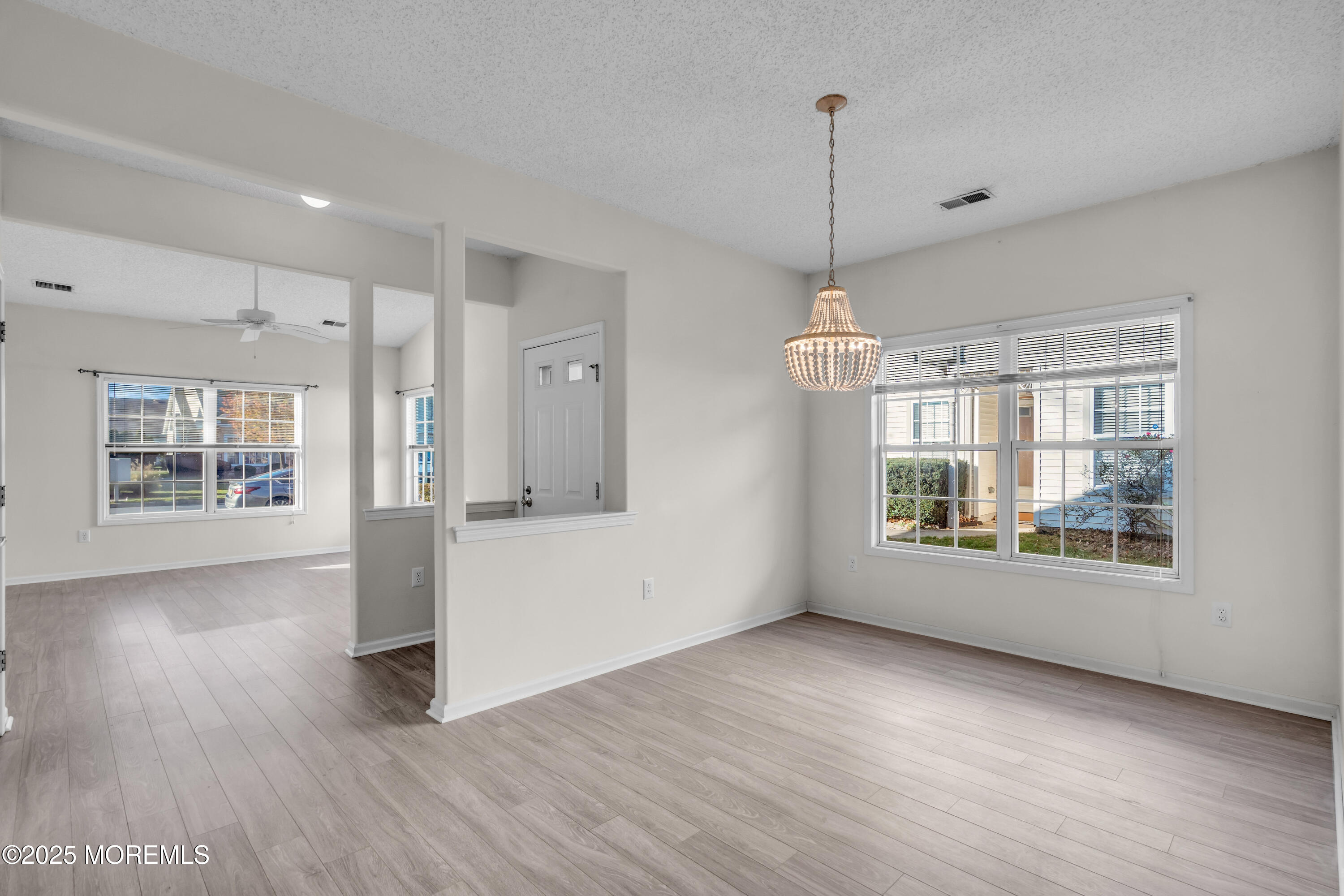 32 Riva Boulevard, Unit 2277 Brick, NJ 08723 - Photo 7 of 23 a view of an empty room with wooden floor and a window