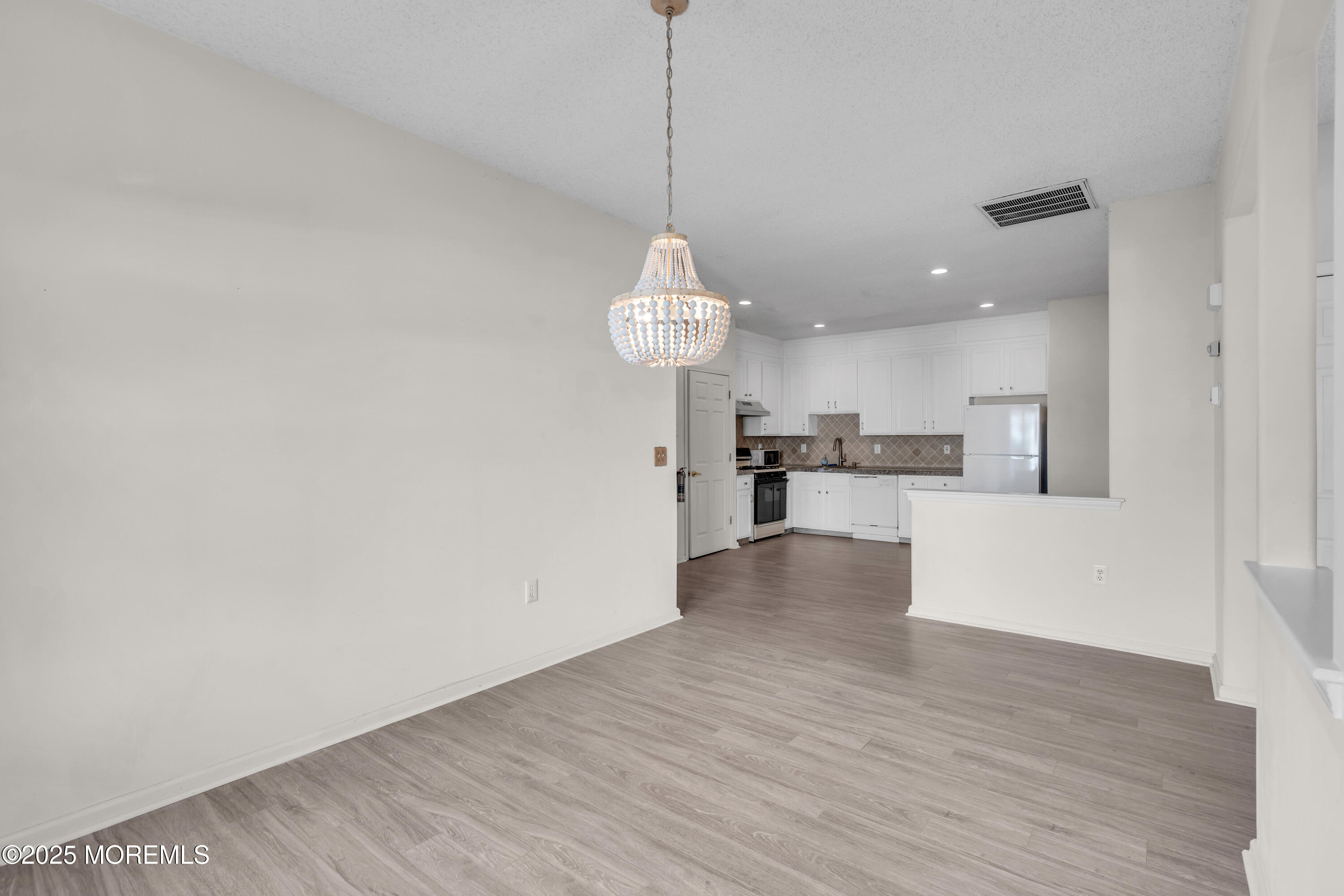 32 Riva Boulevard, Unit 2277 Brick, NJ 08723 - Photo 8 of 23 a view of a kitchen with microwave and cabinets