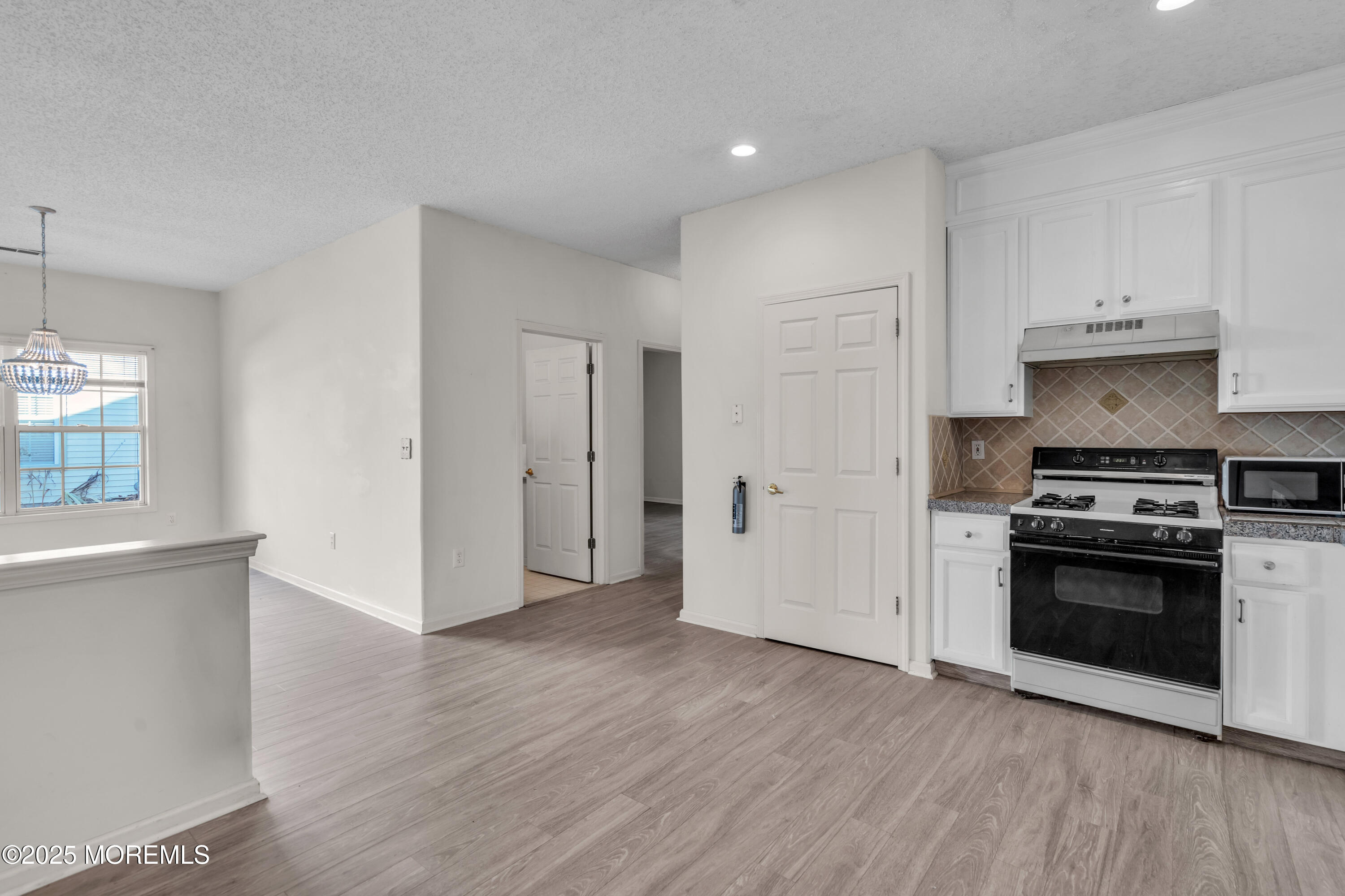 32 Riva Boulevard, Unit 2277 Brick, NJ 08723 - Photo 10 of 23 a view of a kitchen with wooden floor and a sink
