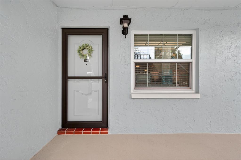 1430 Heather Ridge Boulevard, Unit 101 Dunedin, FL 34698 - Photo 3 of 44 a front view of a house with a window