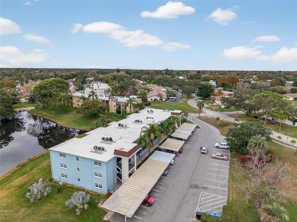 1430 Heather Ridge Boulevard, Unit 101 Dunedin, FL 34698 - Photo 37 of 44 an aerial view of a house with a yard