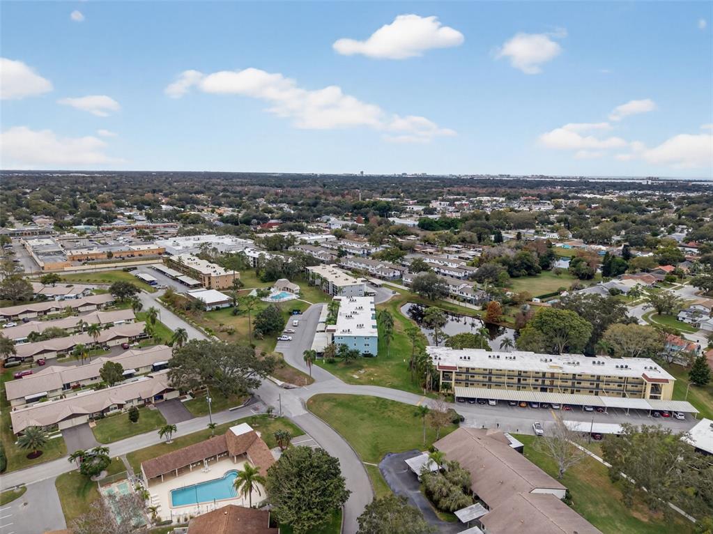1430 Heather Ridge Boulevard, Unit 101 Dunedin, FL 34698 - Photo 41 of 44 an aerial view of a house with a yard
