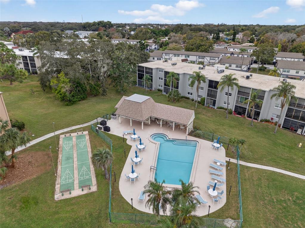 1430 Heather Ridge Boulevard, Unit 101 Dunedin, FL 34698 - Photo 44 of 44 a aerial view of a house with a big yard