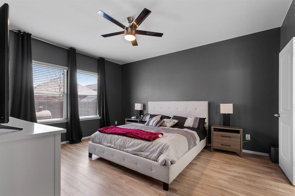 3213 Evening Wind Road Denton, TX 76208 - Photo 13 of 28 a bedroom with a large bed and a large window