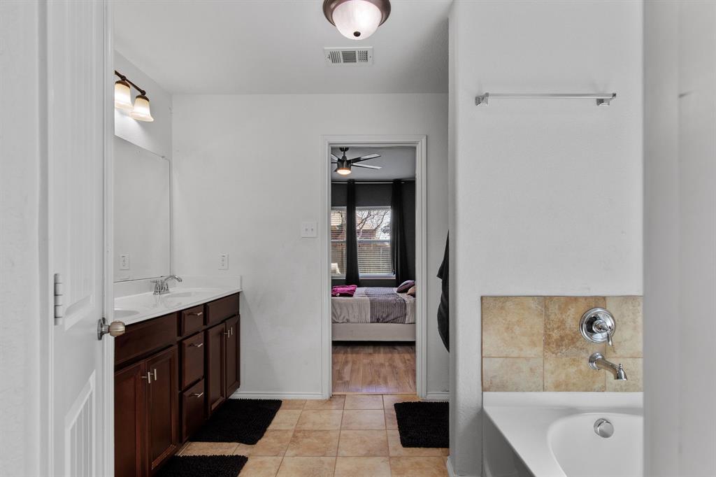3213 Evening Wind Road Denton, TX 76208 - Photo 16 of 28 Primary bathroom consists of garden tub, walk in shower, large walk in closet, and double vanity