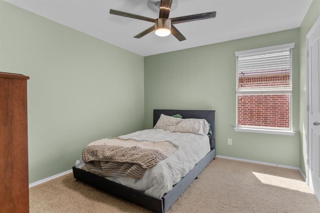 3213 Evening Wind Road Denton, TX 76208 - Photo 20 of 28 a bedroom with a bed and window