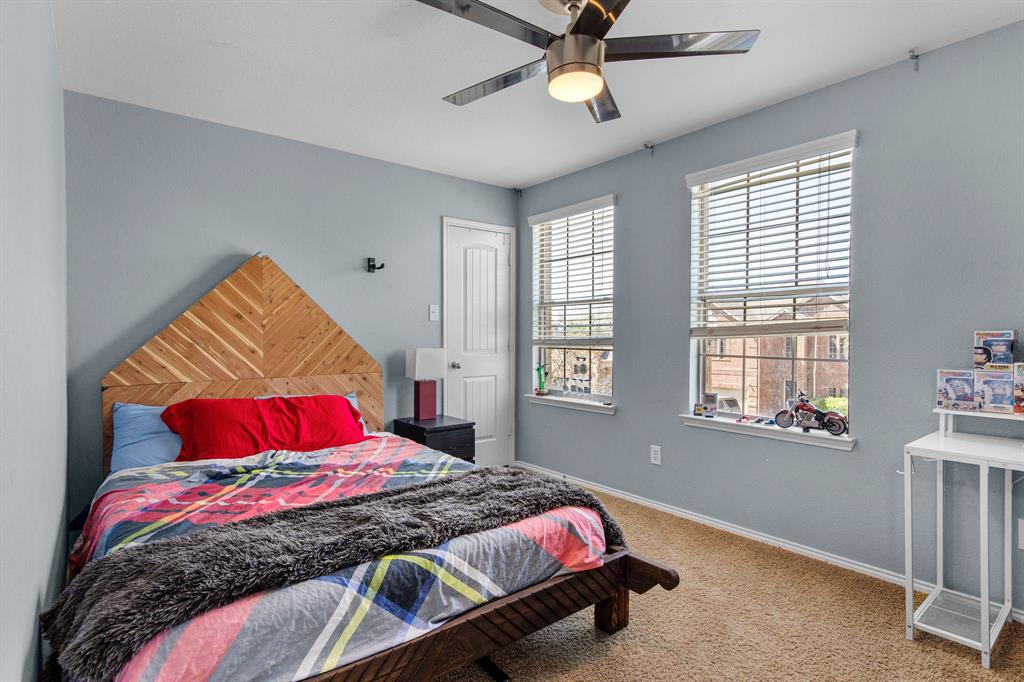 3213 Evening Wind Road Denton, TX 76208 - Photo 21 of 28 a bedroom with a bed and a window
