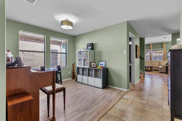 a view of a livingroom with furniture and a window