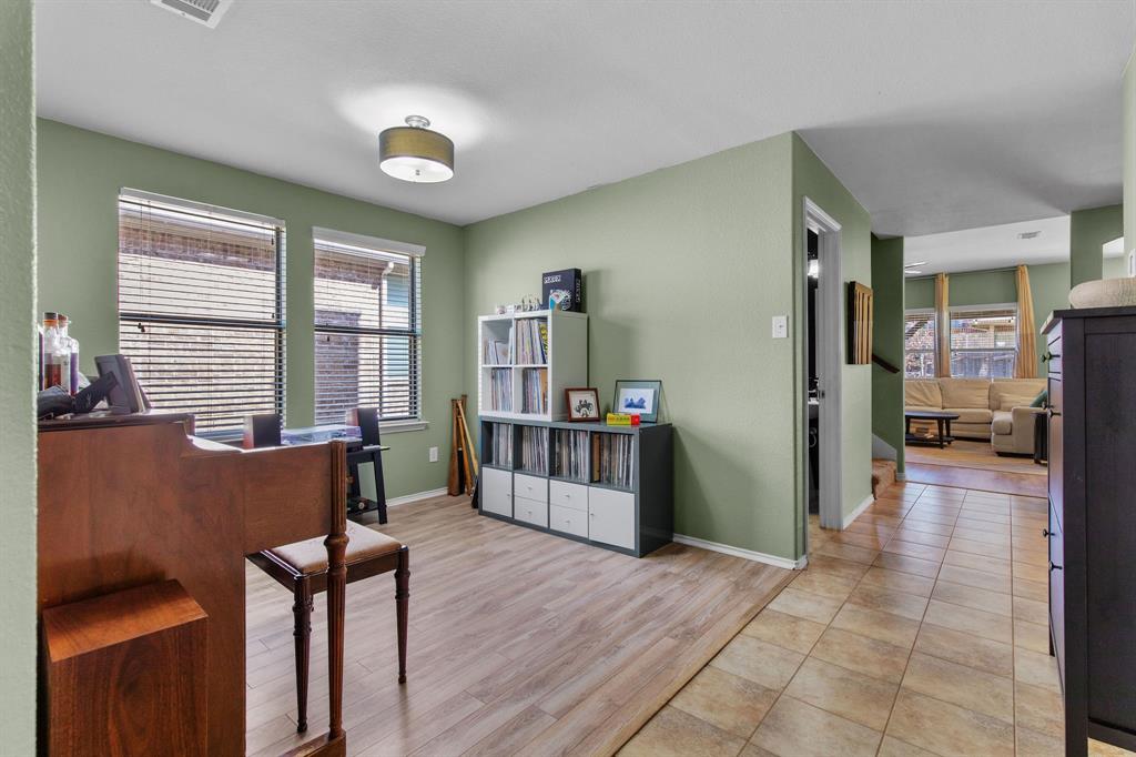 3213 Evening Wind Road Denton, TX 76208 - Photo 4 of 28 a view of a livingroom with furniture and a window