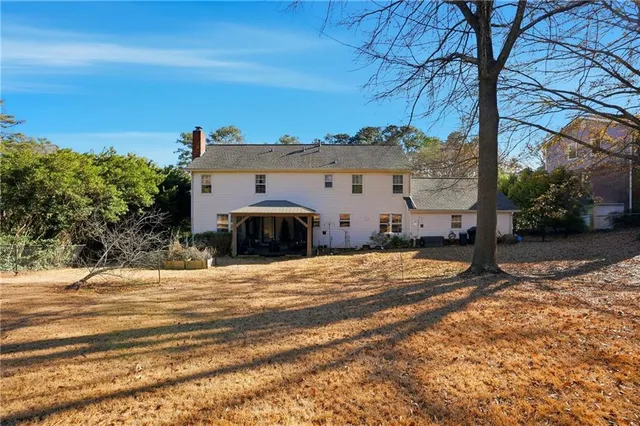 a brick building with a tree in front of it