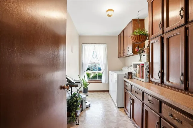 a bathroom with a sink a mirror and next to a window