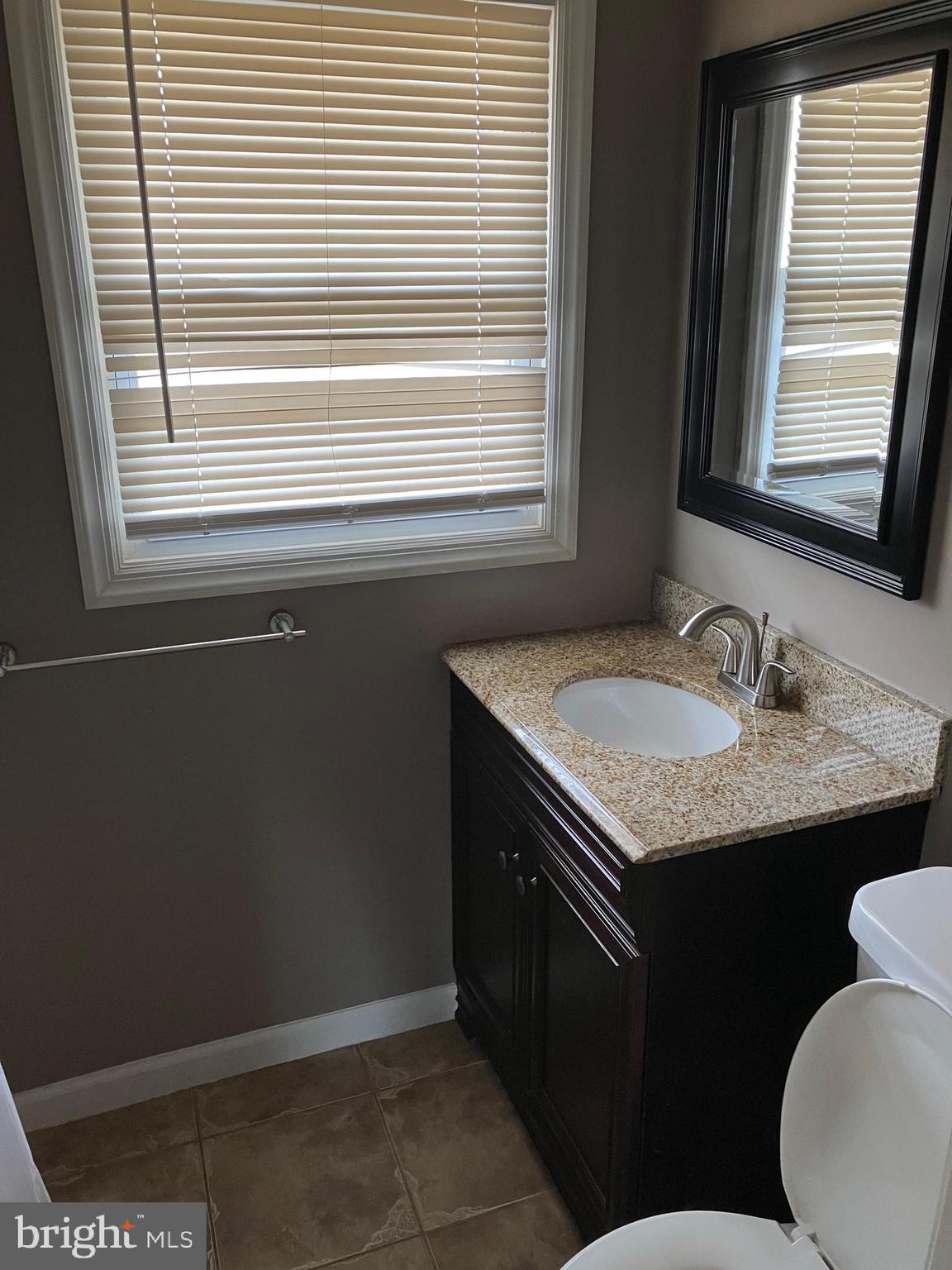 15 Blueberry Lane Willingboro, NJ 08046 - Photo 11 of 14 a bathroom with a sink and a window