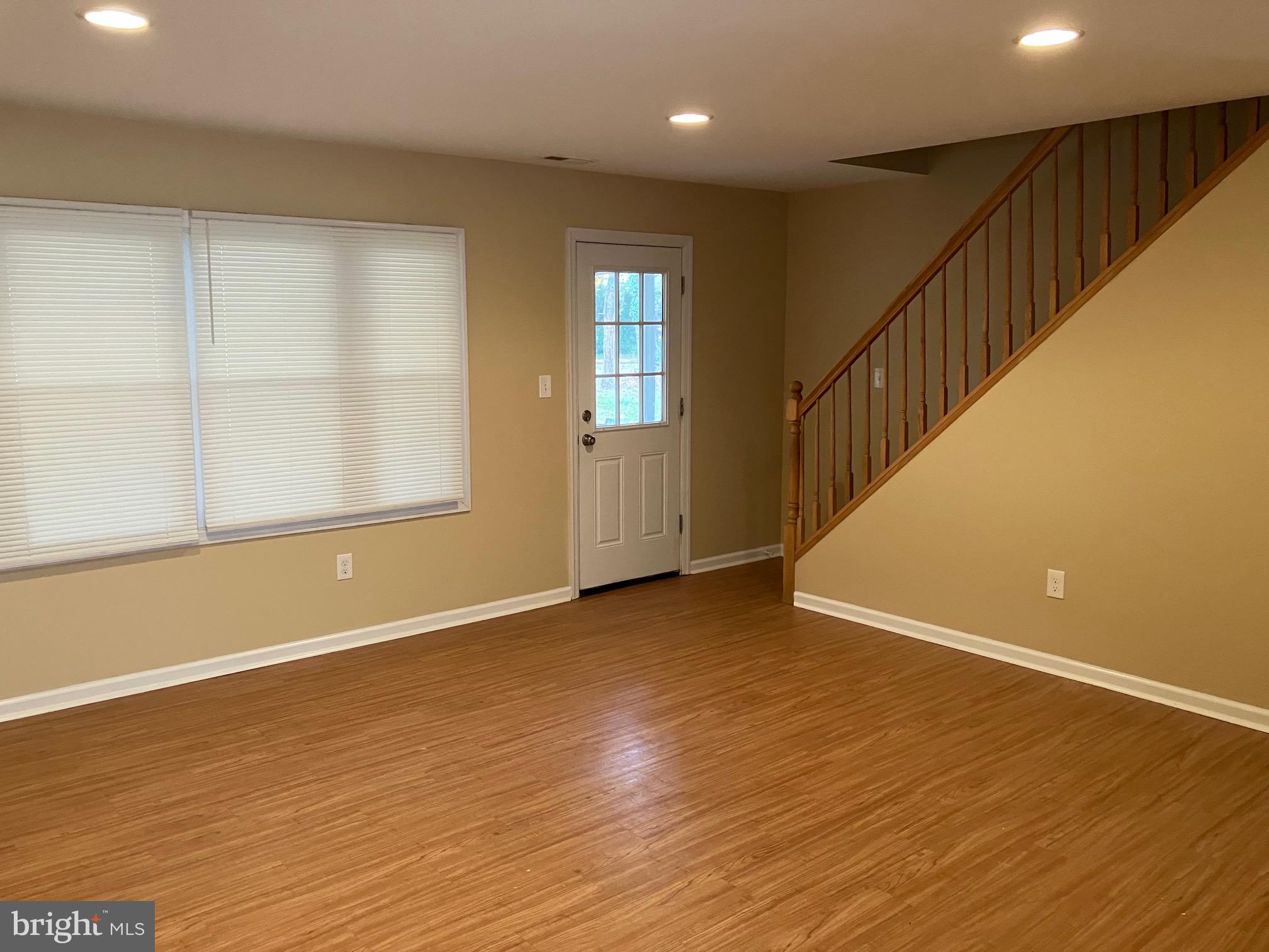 15 Blueberry Lane Willingboro, NJ 08046 - Photo 2 of 14 an empty room with wooden floor and windows