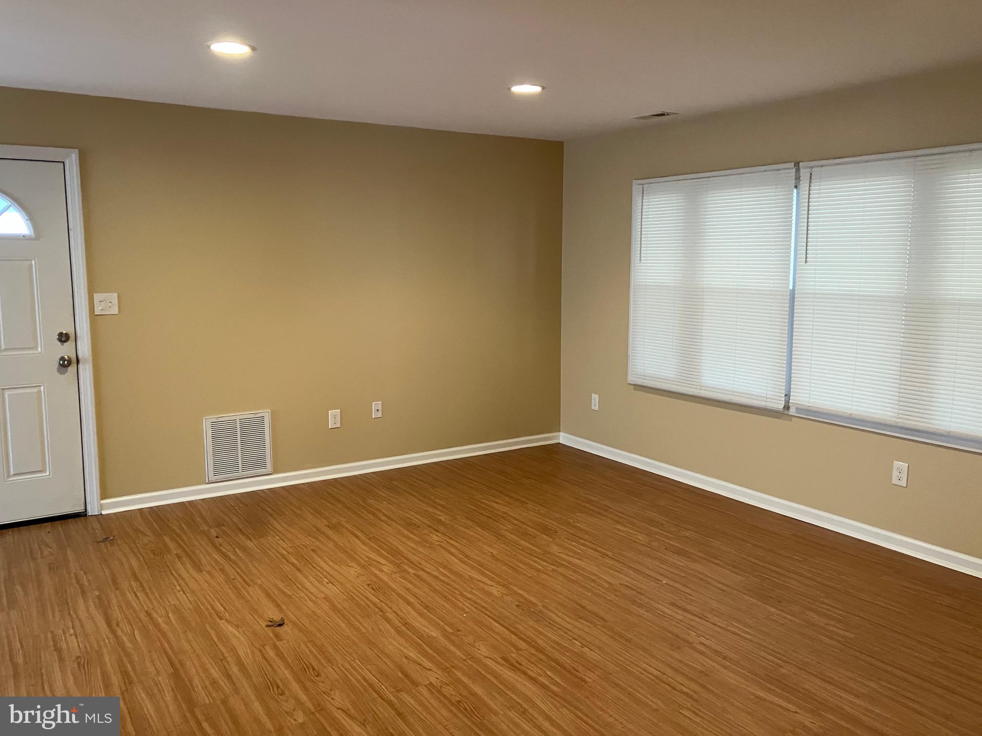 15 Blueberry Lane Willingboro, NJ 08046 - Photo 3 of 14 a view of an empty room with wooden floor and a window