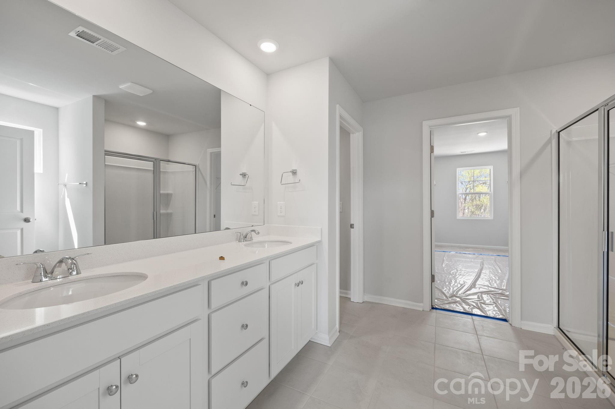 426 Brick House Road York, SC 29745 - Photo 27 of 35 a spacious bathroom with a double vanity sink mirror and double