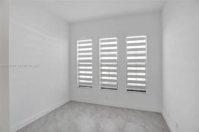 a view of empty room with windows