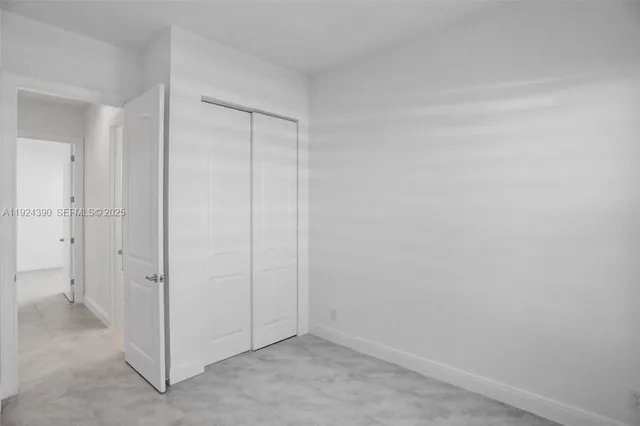 an empty room with white door
