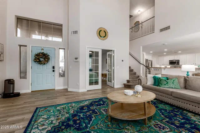 a living room with furniture and a rug