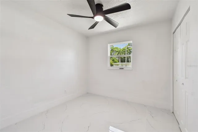 an empty room with closet area