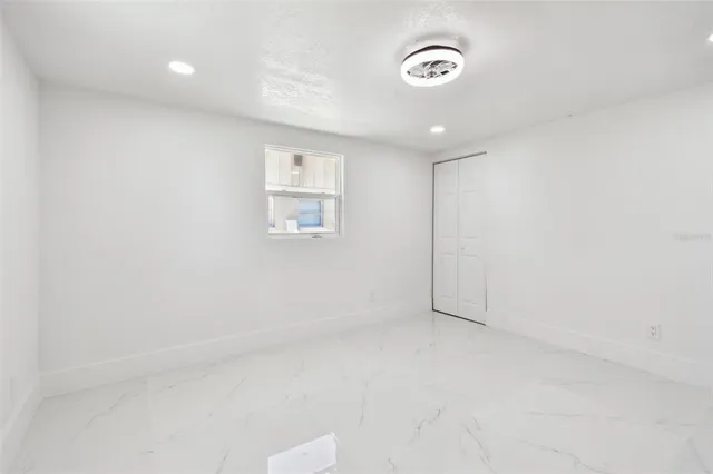 an aerial view of residential building with green space