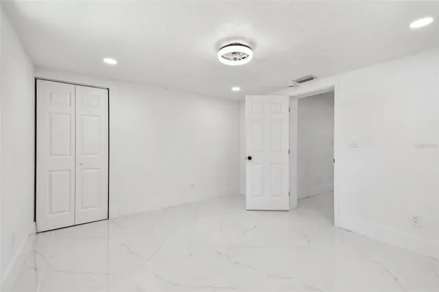 an aerial view of residential house with outdoor space and trees