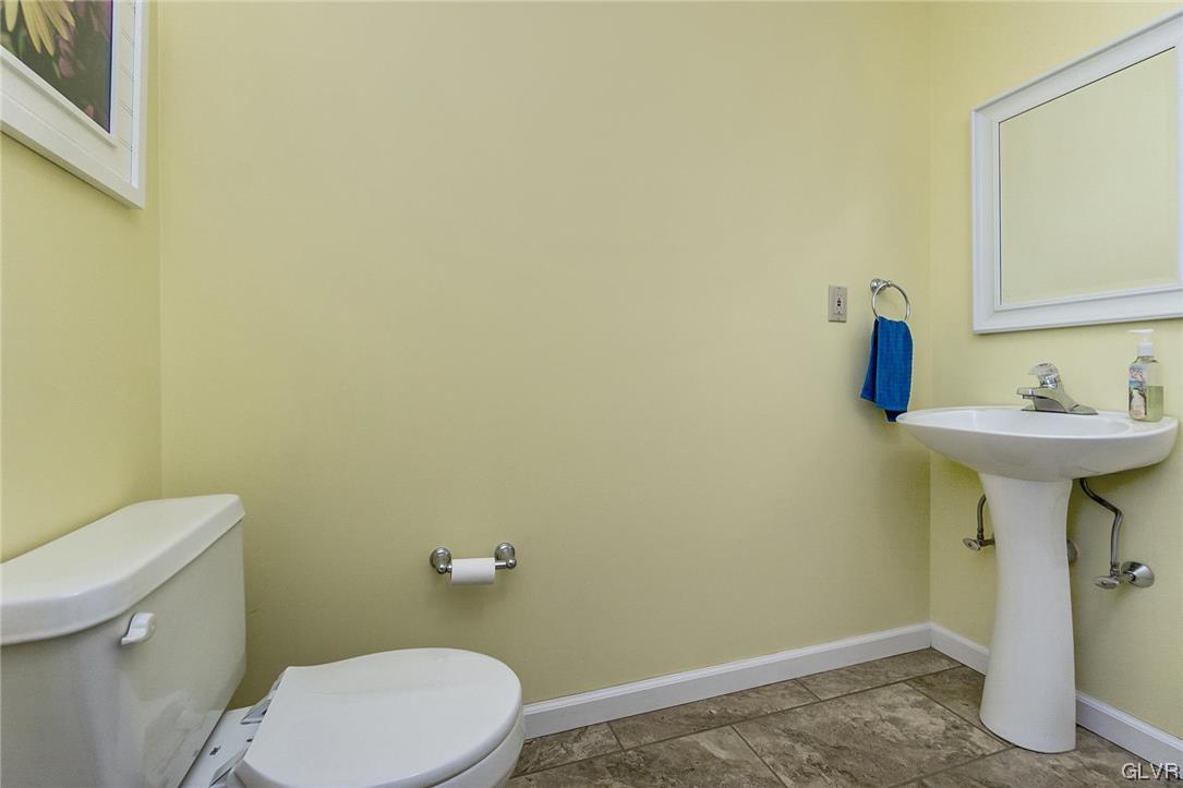 1163 Marfield Drive Nazareth, PA 18064 - Photo 15 of 46 a bathroom with a sink a toilet and a mirror