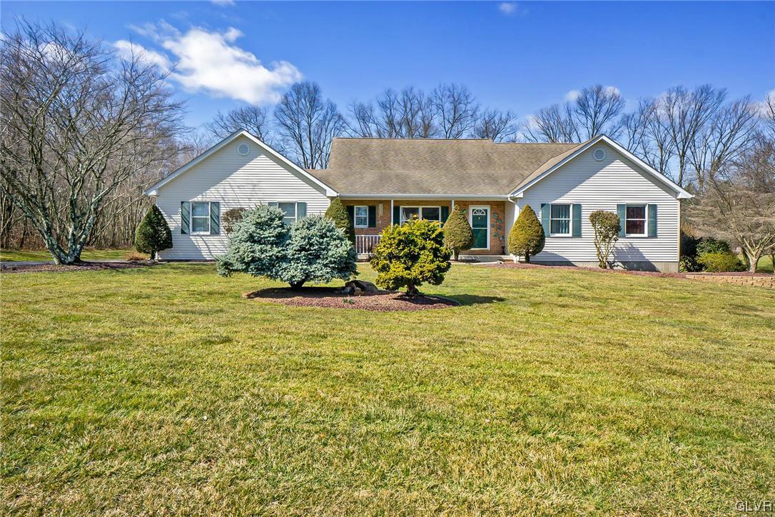 1163 Marfield Drive Nazareth, PA 18064 - Photo 2 of 46 a front view of a house with a garden