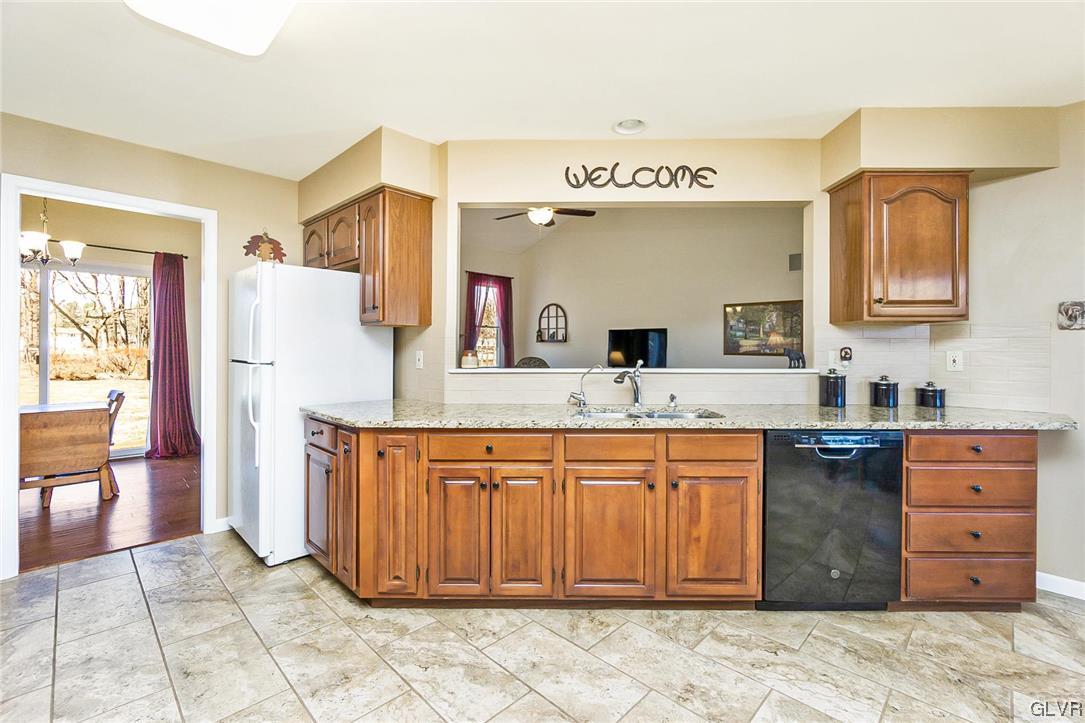 1163 Marfield Drive Nazareth, PA 18064 - Photo 24 of 46 a large kitchen with stainless steel appliances granite countertop a sink and cabinets