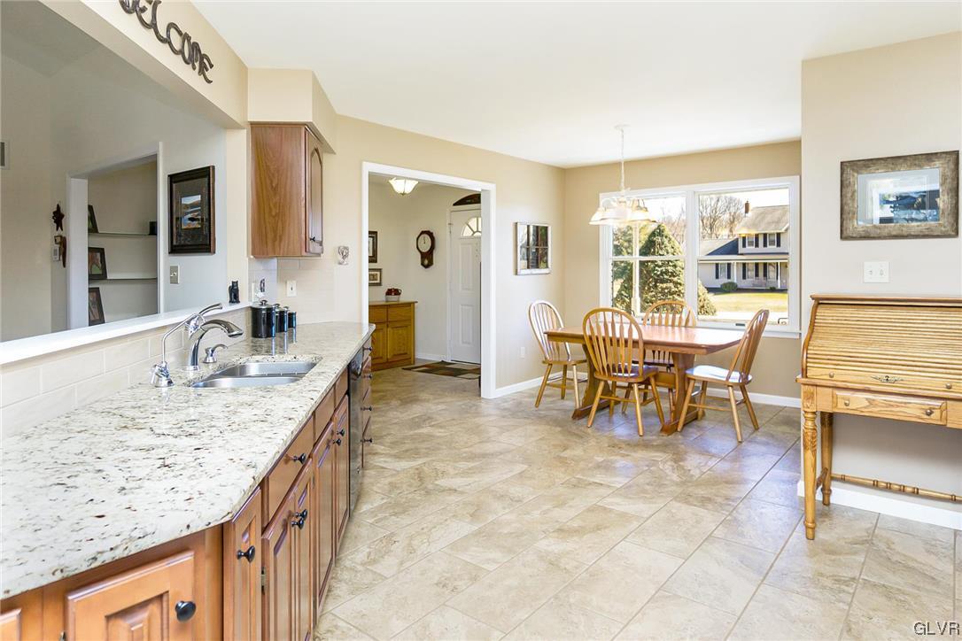 1163 Marfield Drive Nazareth, PA 18064 - Photo 25 of 46 a living room with granite countertop kitchen island furniture and a kitchen view