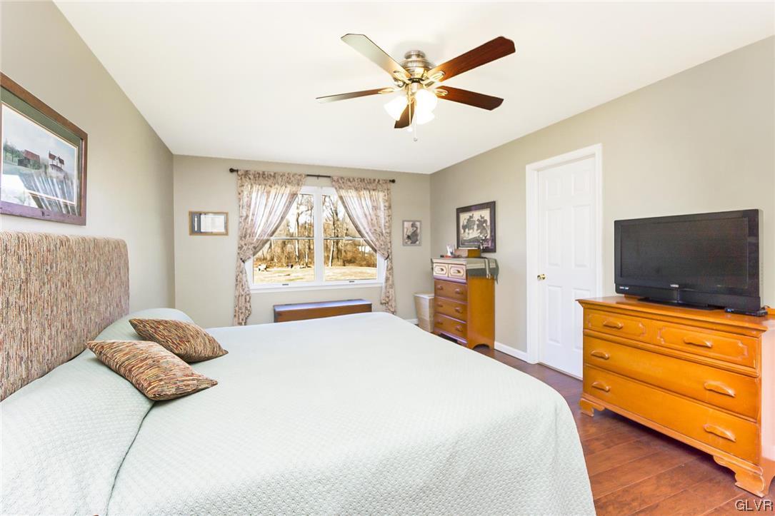 1163 Marfield Drive Nazareth, PA 18064 - Photo 38 of 46 a bedroom with a bed and a flat screen tv