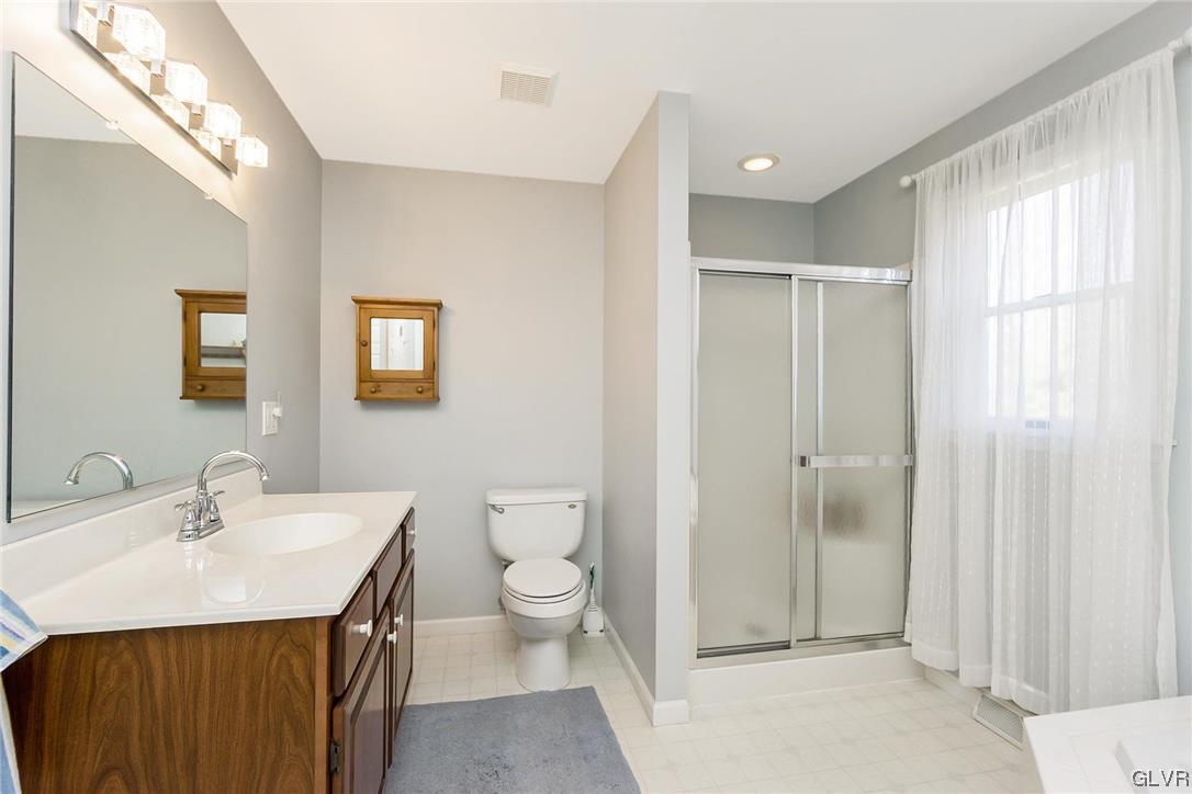 1163 Marfield Drive Nazareth, PA 18064 - Photo 40 of 46 a bathroom with a toilet a sink and mirror