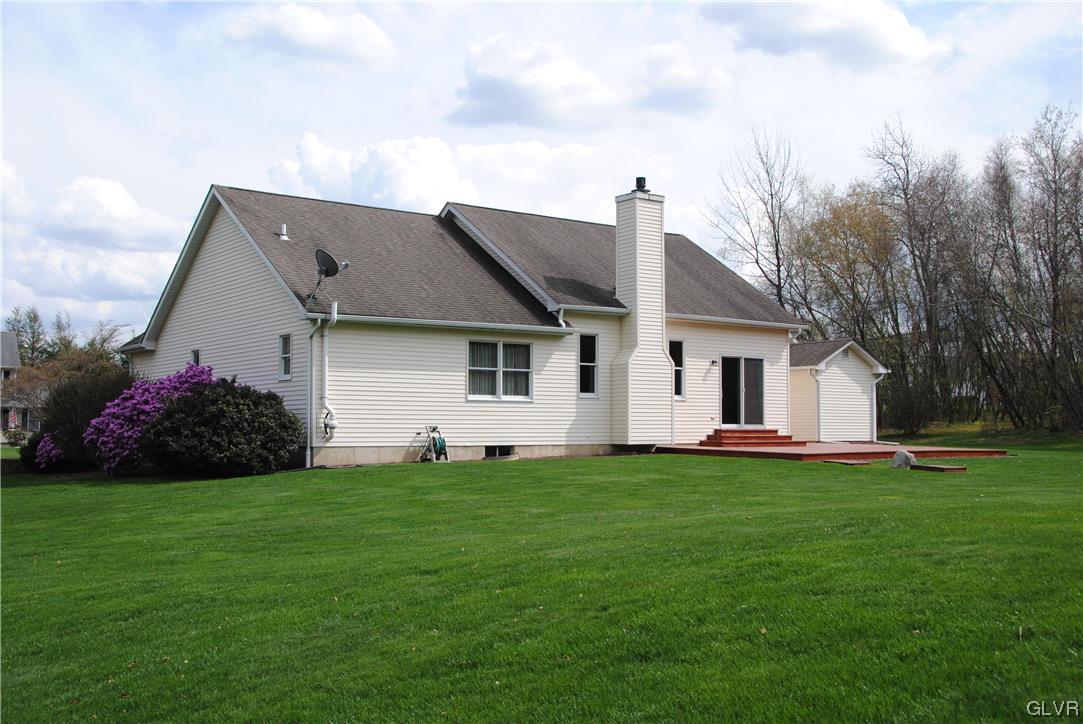 1163 Marfield Drive Nazareth, PA 18064 - Photo 44 of 46 a front view of a house with a garden and yard