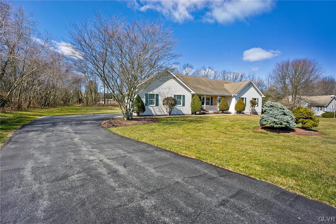 1163 Marfield Drive Nazareth, PA 18064 - Photo 6 of 46 a view of a house with swimming pool and a yard