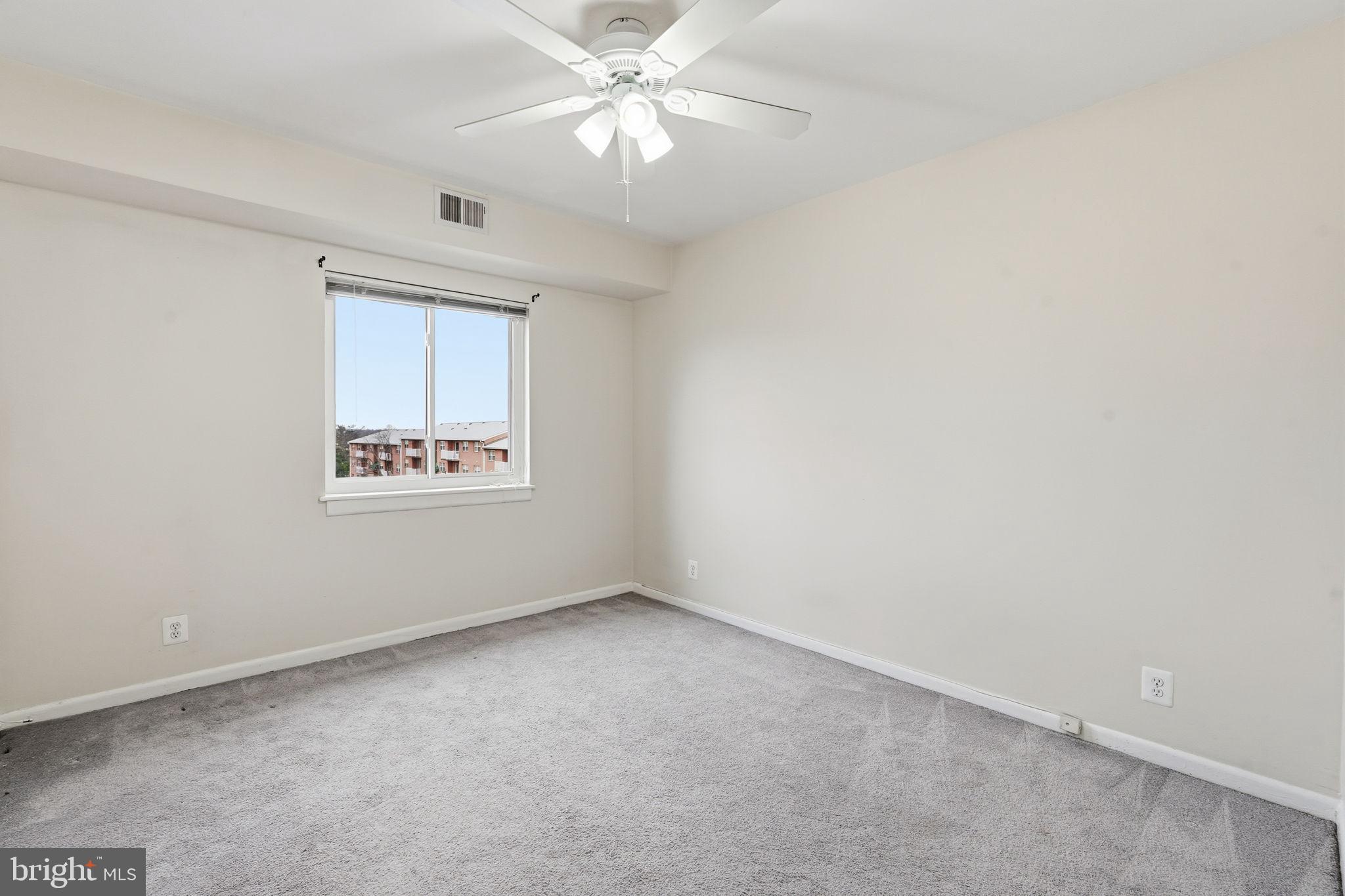 6230 Edsall Road, Unit 403 Alexandria, VA 22312 - Photo 12 of 18 an empty room with a window and a fan