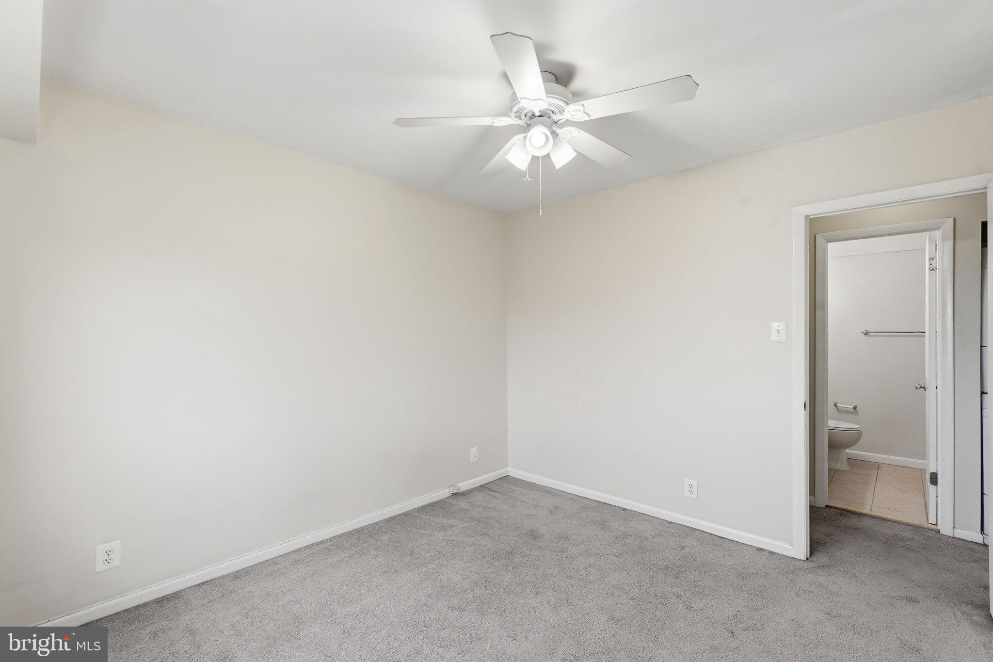 6230 Edsall Road, Unit 403 Alexandria, VA 22312 - Photo 13 of 18 an empty room with a fan and a bathroom